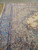 Pale green spandrel and indigo outer border seen from a low angle across floor