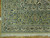 Corner detail with palmettes, ivory guard stripes, cotton fringe and light blue floral accents