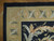Corner detail showing black outer band, gold oval cabochon border and shell rosette panel
