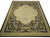 Angled studio view of 12' x 15' Aubusson flat weave rug with ivory medallion on black field