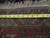 Tape measure across the back of the Mahal rug showing weave density and cotton foundation