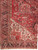 10x14 Persian Heriz rug corner detail with ivory spandrel, navy rosette border and olive guard stripe