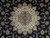Close-up of ivory medallion with rose, sage and grey blue palmettes on black wool