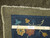 Back of the hand-knotted wool rug with ruler, cotton foundation, ivory fringe and authenticity tag