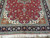 7x10 Persian rug detail with red field palmettes, vine scrolls and multi-band navy borders