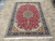 Full overhead view of the 7' x 10' Persian Tabriz rug showing balanced medallion and borders