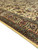Border detail of hand-knotted wool pile with sage green vine scroll, rose blossoms and burgundy flowers
