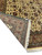 Folded corner revealing fine hand-knotted back, cotton foundation and ivory fringe of this Persian Tabriz rug