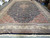 Warehouse floor photo of the 14 x 24 rug showing full medallion layout and fringed end