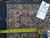 Back of the rug with inventory tag, showing knot structure and a tape measure for scale