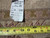 Back tag reading genuine hand woven Oriental rug number PIX-104 beside tape measure verifying size