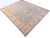13'6" x 15'10" Chobi Peshawar wool rug angled on white, all over floral Ziegler design