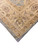 Close-up of the ivory main border with palmettes, rosettes and slate green outer guard stripe