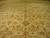 Angled view of the 16x24 Indian Jaipur rug showing soft sage and rose floral tracery