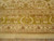 Detail of triple border bands with vine scroll, zigzag guard stripes and ivory fringe