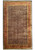 Full overhead view of navy Herati field oversize wool rug with rust floral border