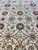 13x24 Jaipur rug field close-up showing green, pink and burgundy linked rosettes