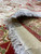 Fringe and cotton foundation close-up with folded edge revealing the woven back