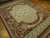 9x12 Aubusson flat weave rug angled on parquet, cornucopia corner with pink roses and foliage