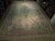 Angled view of long ivory Kerman rug with teal blue floral borders and cream fringe