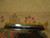 Inch ruler on border flowers showing scale of hand-knotted wool pile and tulip motifs