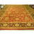 16' x 24'4" Jaipur rug displayed in showroom, red field framed by wide black border