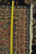 Tape measure across border showing low 3/8 inch antique pile and hand-knotted wool weave