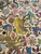 Detail of a yellow lion, boar and deer woven into the hunting field