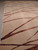 Close corner view showing low clipped pile and the silk sheen on the copper lines