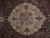Close view of the lobed ivory medallion with pale blue centre and salmon rosette panels