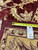 Tape measure and tag marked B-74976, 12.8 x 17.11, lying on the rug back