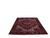 Angled floor view showing the near square 8x9 Heriz rug laid flat under natural light