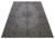 Angled floor view showing the whole 9'9" x 13'2" Kashan rug and its fringed ends