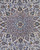 Close-up of the medallion, lilac scrollwork around a pale green centre on ivory ground