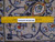 Reverse of the rug with a ruler laid across eight inches over the knotted wool back