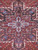 Close-up of the layered central medallion with blue, ivory and rose leaf motifs on wool pile