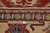 Back of the rug with ruler showing knot density, ivory fringe and hand-knotted wool construction
