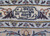 Woven signature cartouche in the border of this signed Persian Kashan workshop rug, navy script