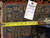 Reverse of rug with inventory tag 5326 and tape measure showing even knot rows