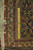 Back of the 9'9 x 15'10 Tabriz rug with ruler measuring knots per square inch