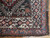 Corner detail showing ivory main border, teal guard stripe and original selvage on antique tribal rug