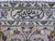 Woven signature cartouche in the ivory border, dark navy script confirming a workshop signed Kashan rug