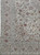 Corner detail showing multi-band floral border, ivory field and red brown palmettes on hand-knotted wool pile