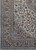 Corner detail showing taupe main border, navy vine scrolls and the ivory flowering field