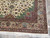 Corner detail showing bird motifs, vase palmettes and camel main border of wool silk weave