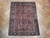 6 x 8 Heriz rug laid on herringbone parquet floor showing stepped medallion and ivory guard stripes