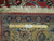 Back of the 8'2" x 11' Tabriz rug with ruler showing tight hand-knotted wool weave