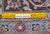 Ruler on the rug back showing fine wool knot density and Authentic Handmade label