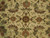 Close-up of ivory field with rust palmettes, sage leaves and gold rosettes in silk highlights