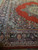 Semi-antique 1940s Kerman corner, open coral field meeting deep indigo floral border bands